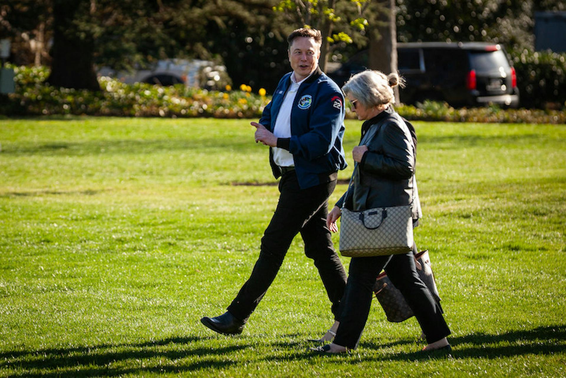 Elon Musk walking outside 