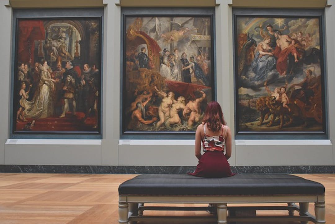 Woman contemplating an Old Master painting