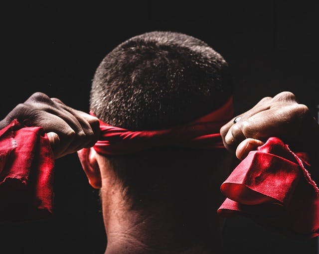 Man tying a headband