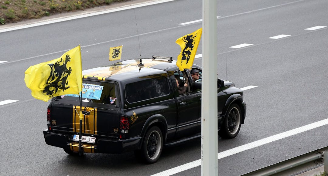 Extreme right fans with Vlaams Belang flag