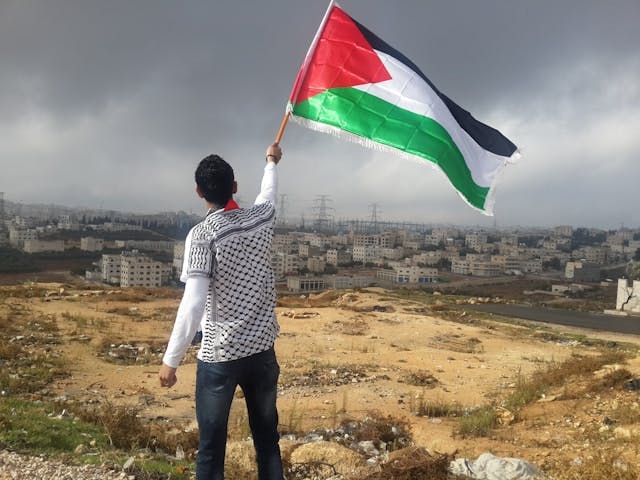 Young person with Palestinian flag