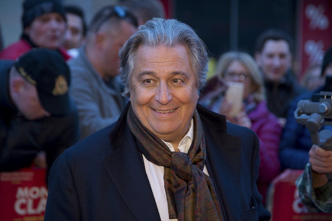 Christian Clavier tout sourire
