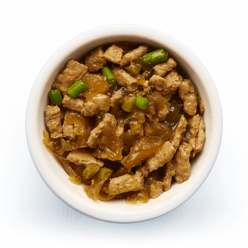 An image of Tails wet food. Steamed fillets with lamb, chicken & green beans in tasty jelly.