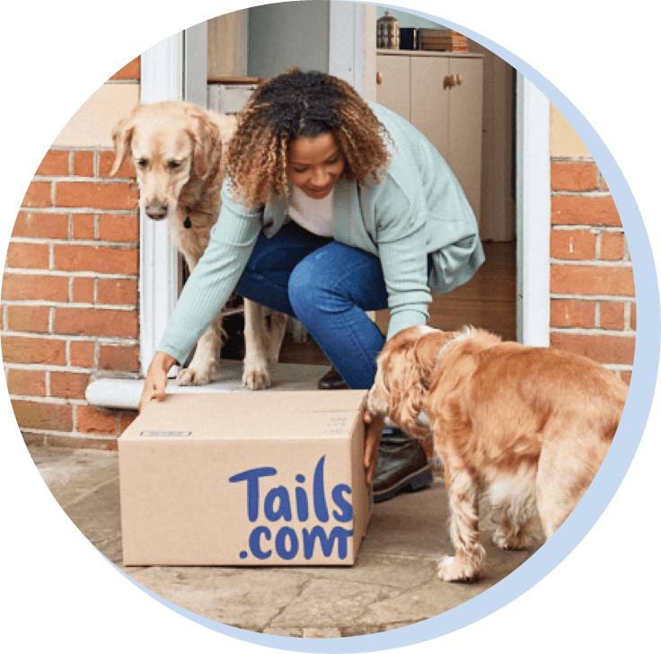 A happy customer with her tails.com delivery