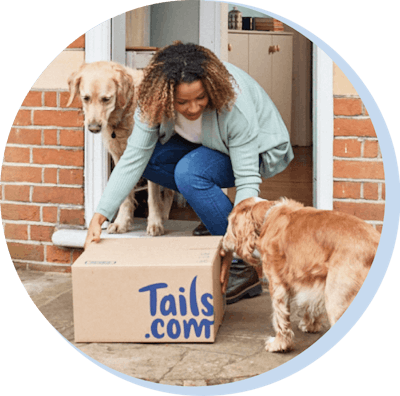 A happy customer with her tails.com delivery