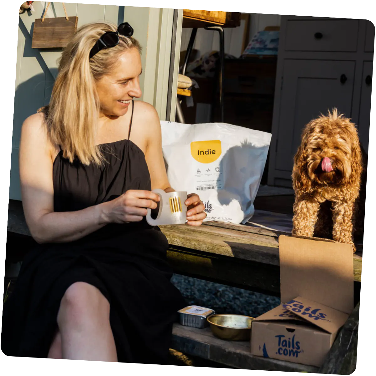 A happy customer with her tails.com delivery