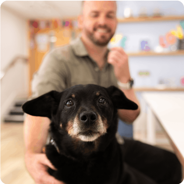 Head Vet Sean and a dog