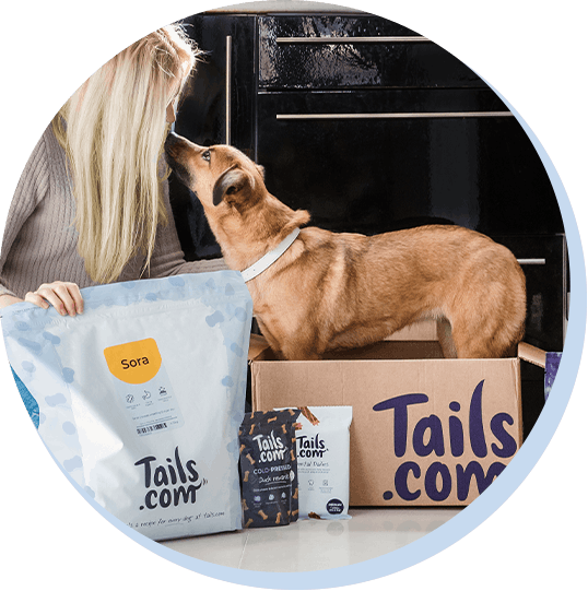 A happy customer with her tails.com delivery