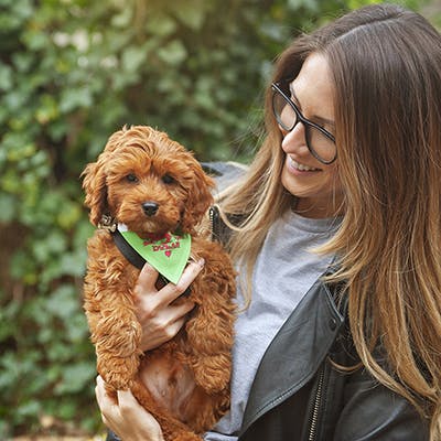 Lucy holding her Cavapoo puppy, Dylan