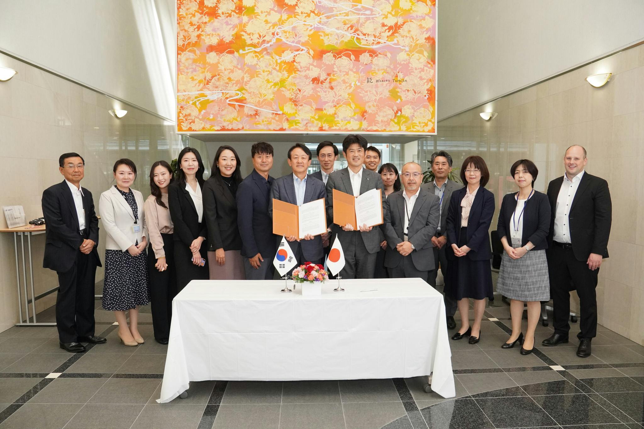 At the signing ceremony, (far left) Dr. Gomi, Scientific Director of Takanawa, & Bolli, CEO of Takanawa (far right)