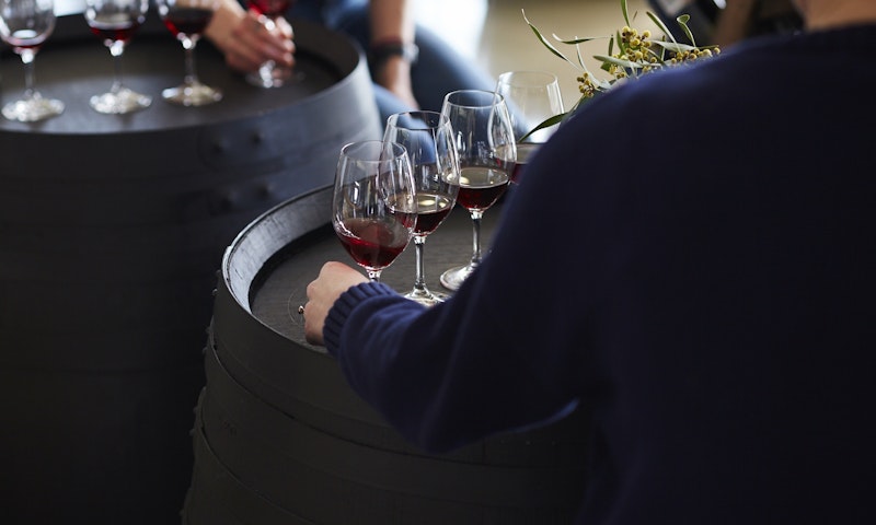 Holding wine glasses on barrel