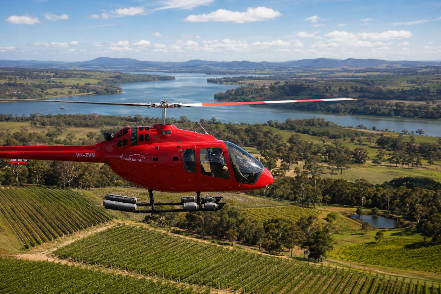 A helicopter flying over Tamar Ridge vineyard