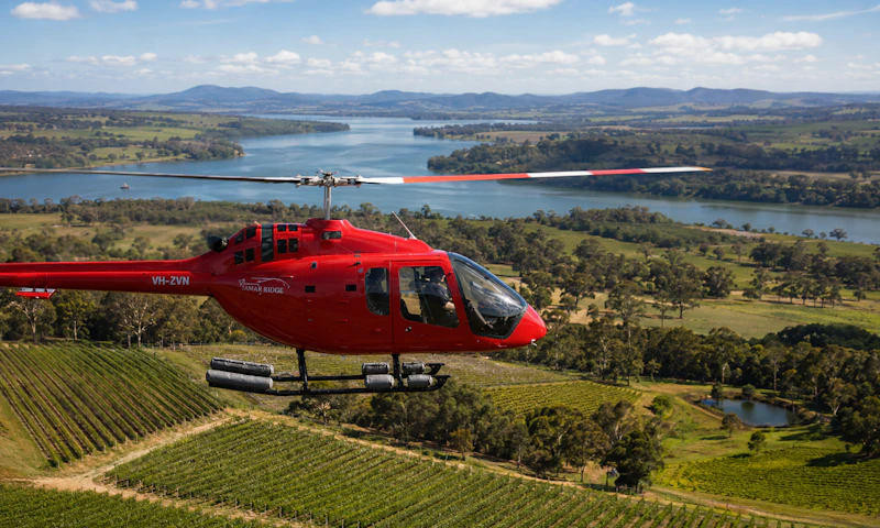 A helicopter flying over Tamar Ridge vineyard