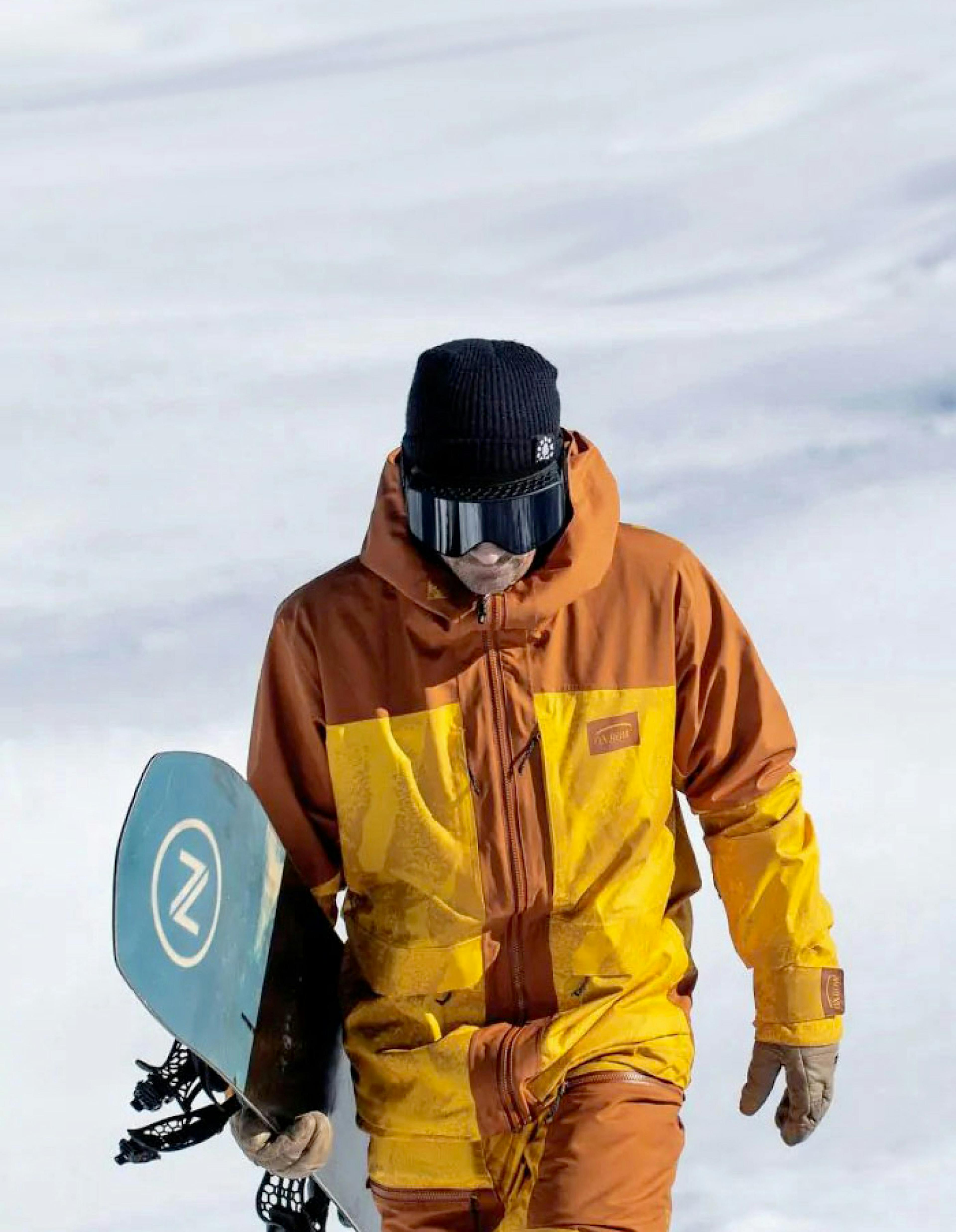 Man holding a snowboard