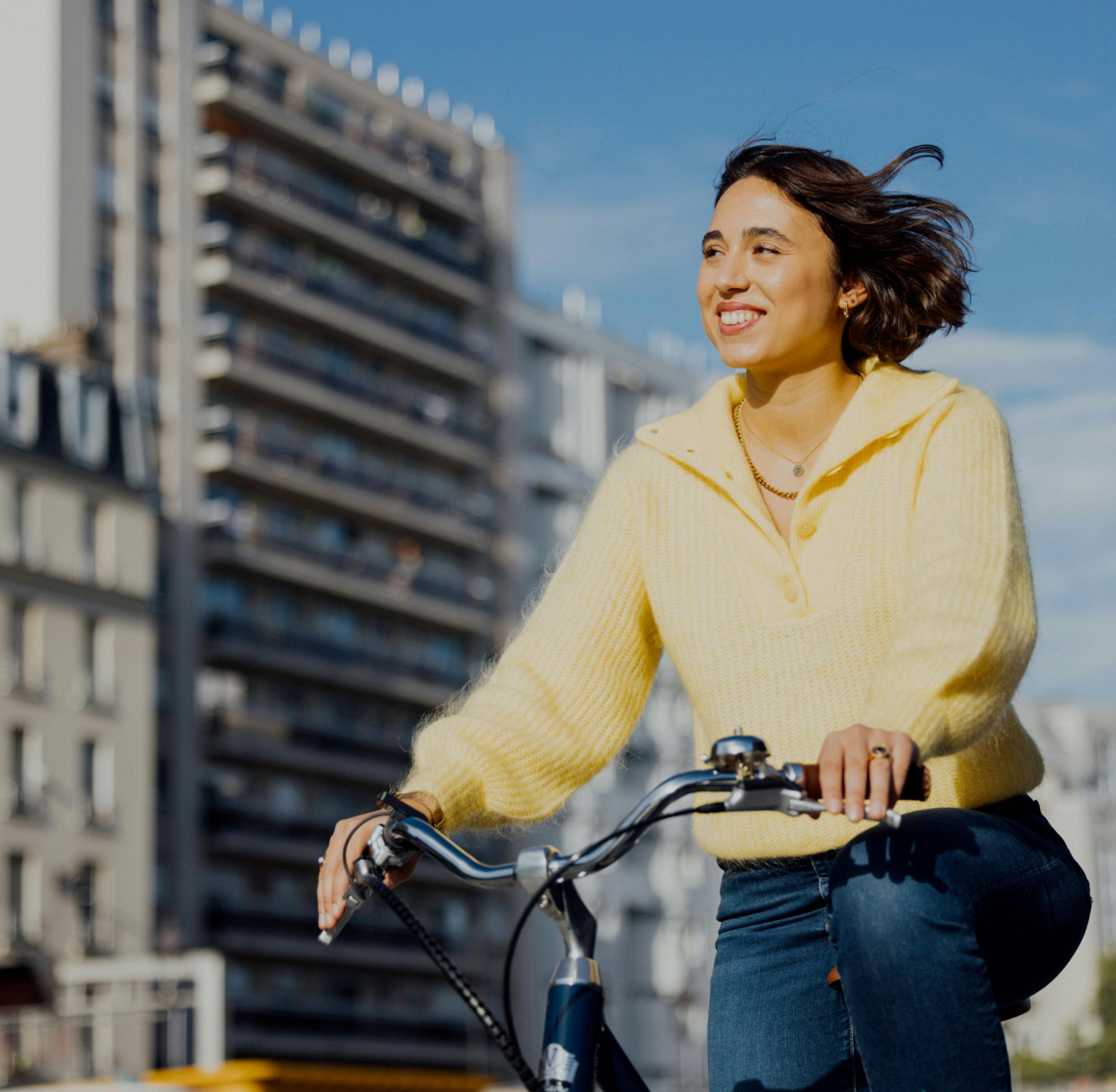 Woman on a bike smiling