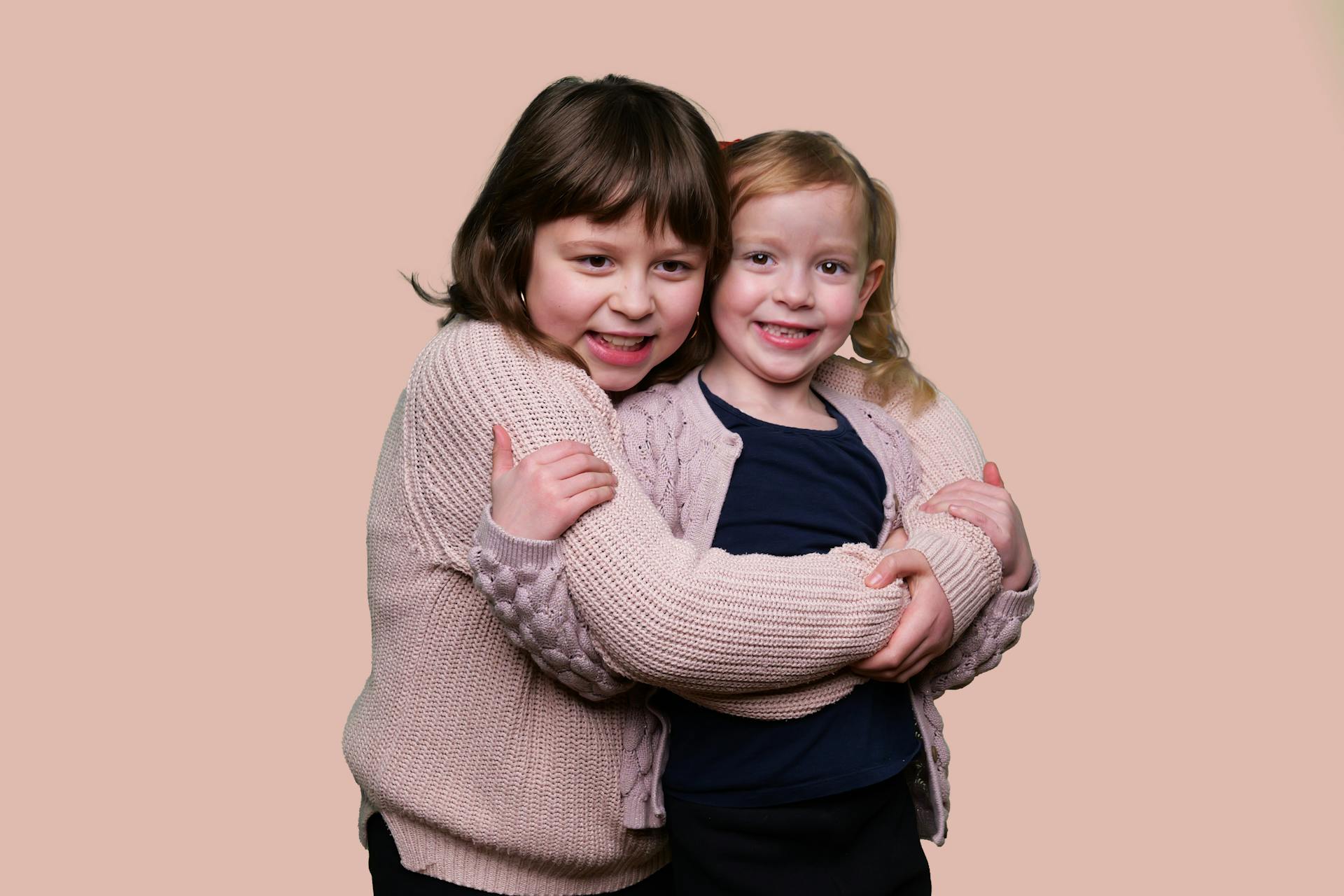 Two sisters hugging each other