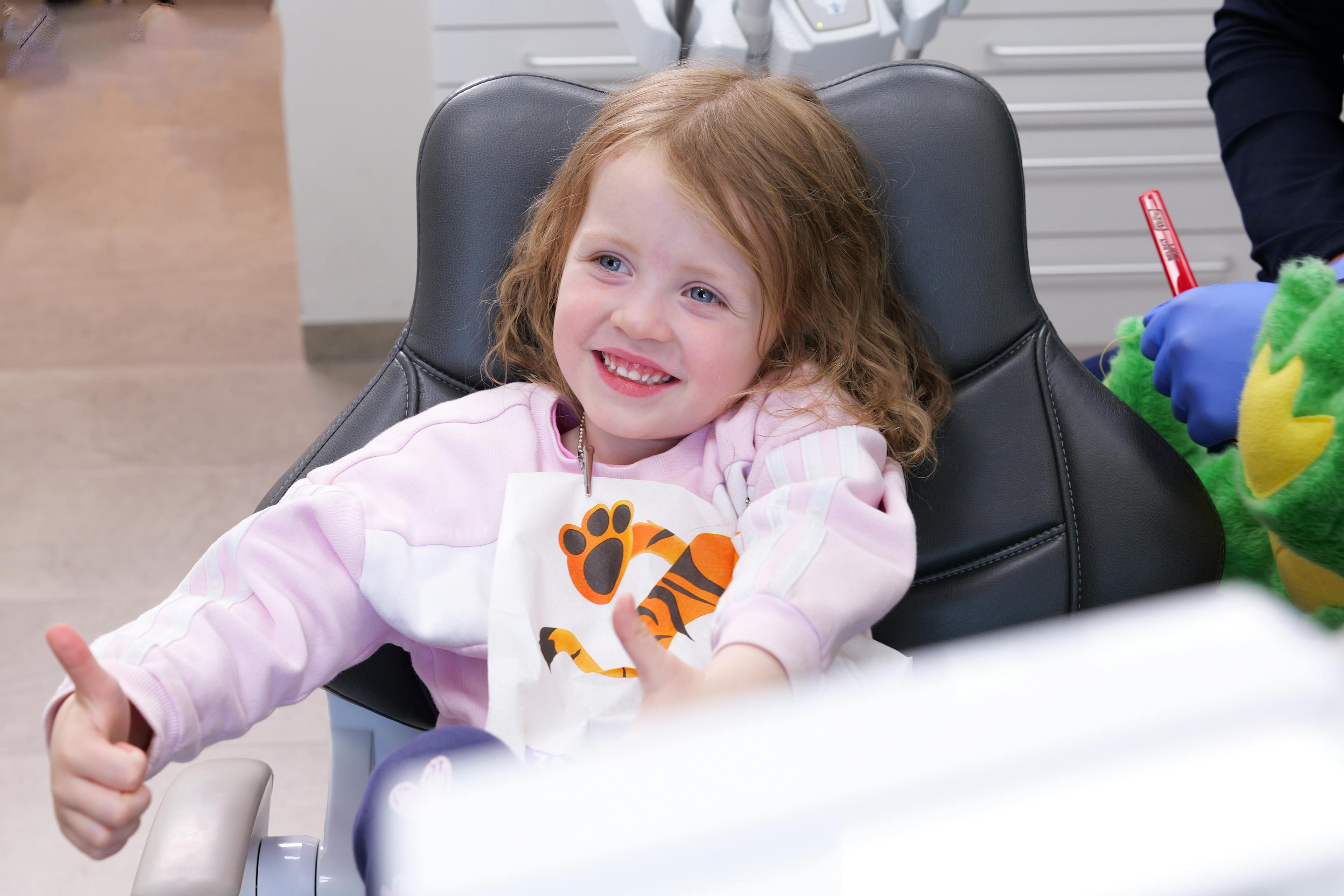 kid smiling at the dentist