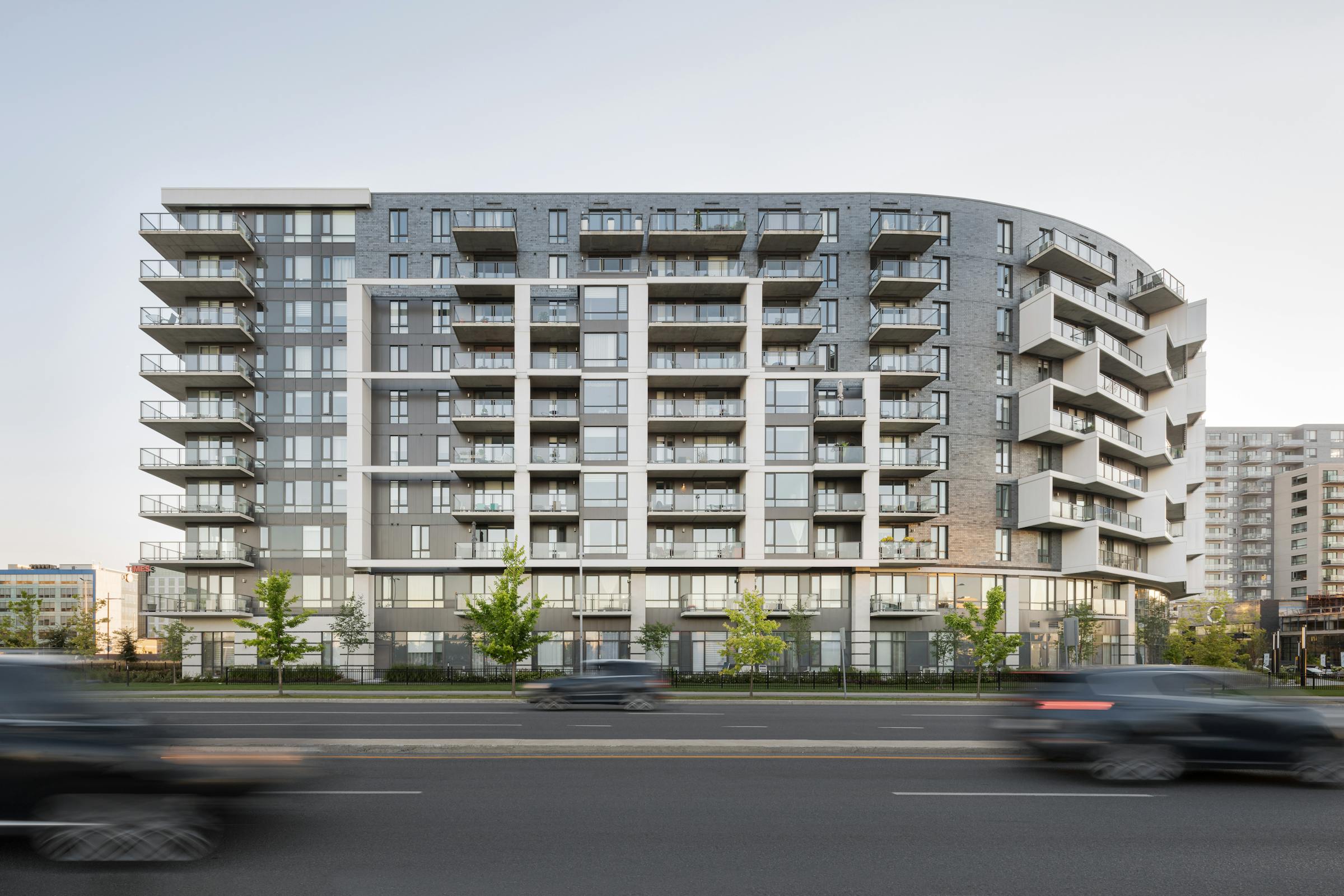 Long exposure photograph of the rounded facade of a building showing the textures of the materials used