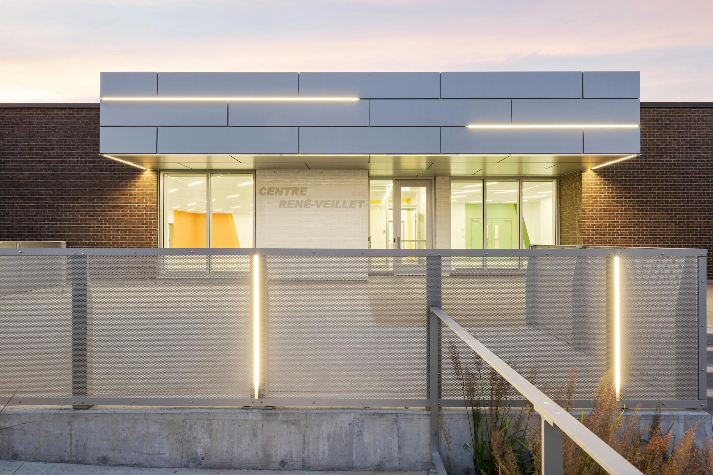 Architectural photography of the facade of an institutional building with creative lighting.