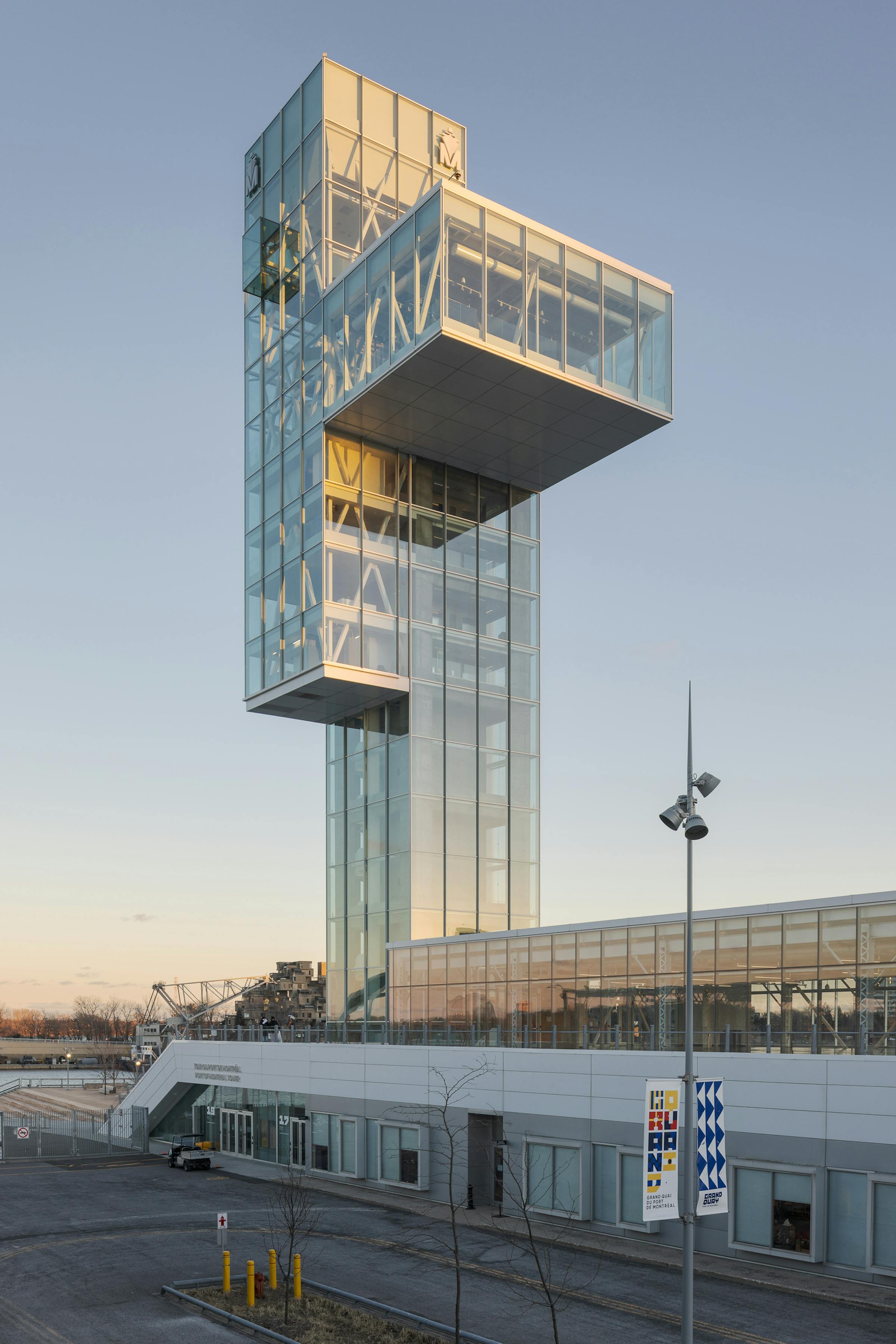Architectural photograph of the Grand Quai tower in Montreal. Natural light from the setting sun is dominant.