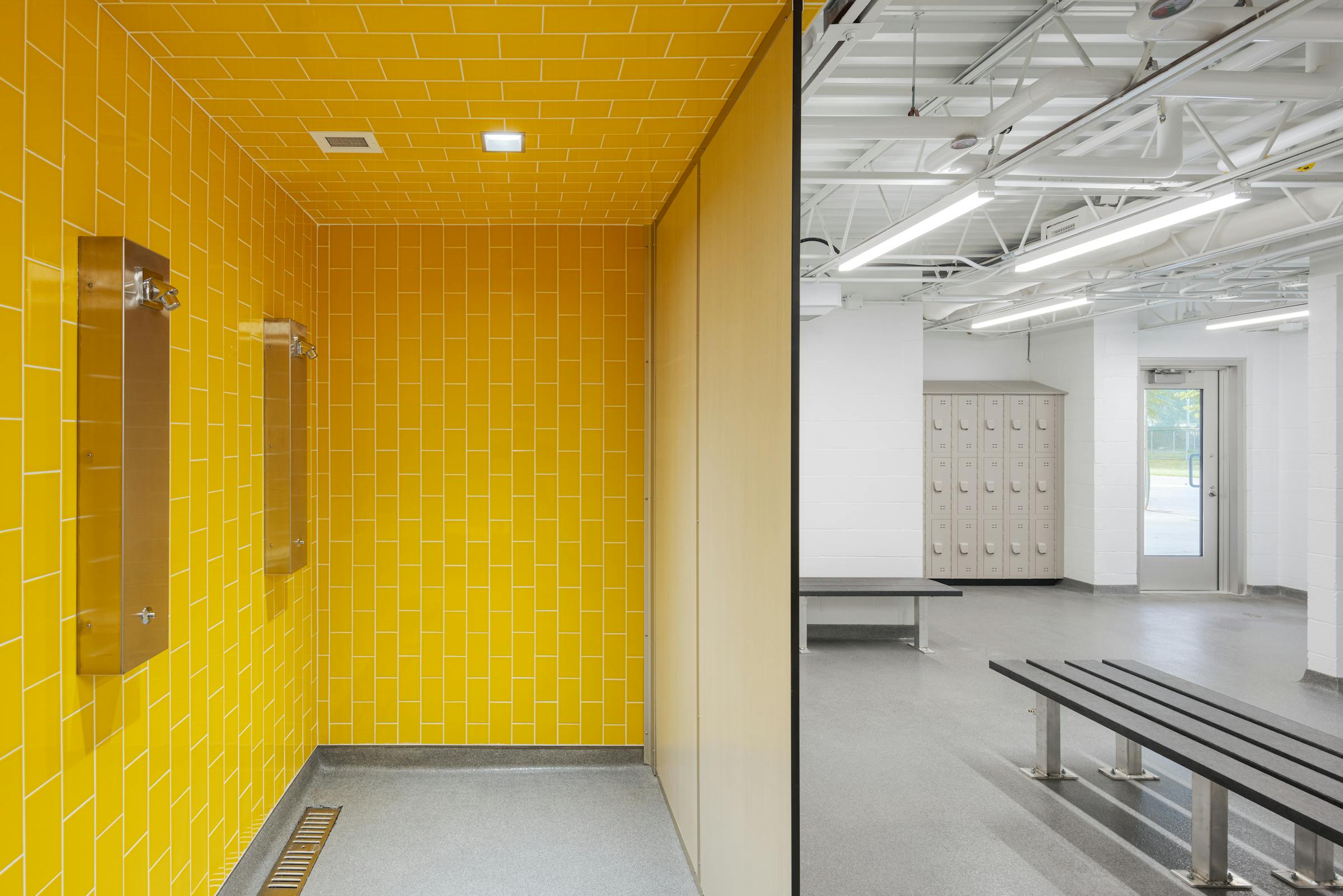 Interior photograph of the changing rooms of a park pavilion with a strong color contrast.