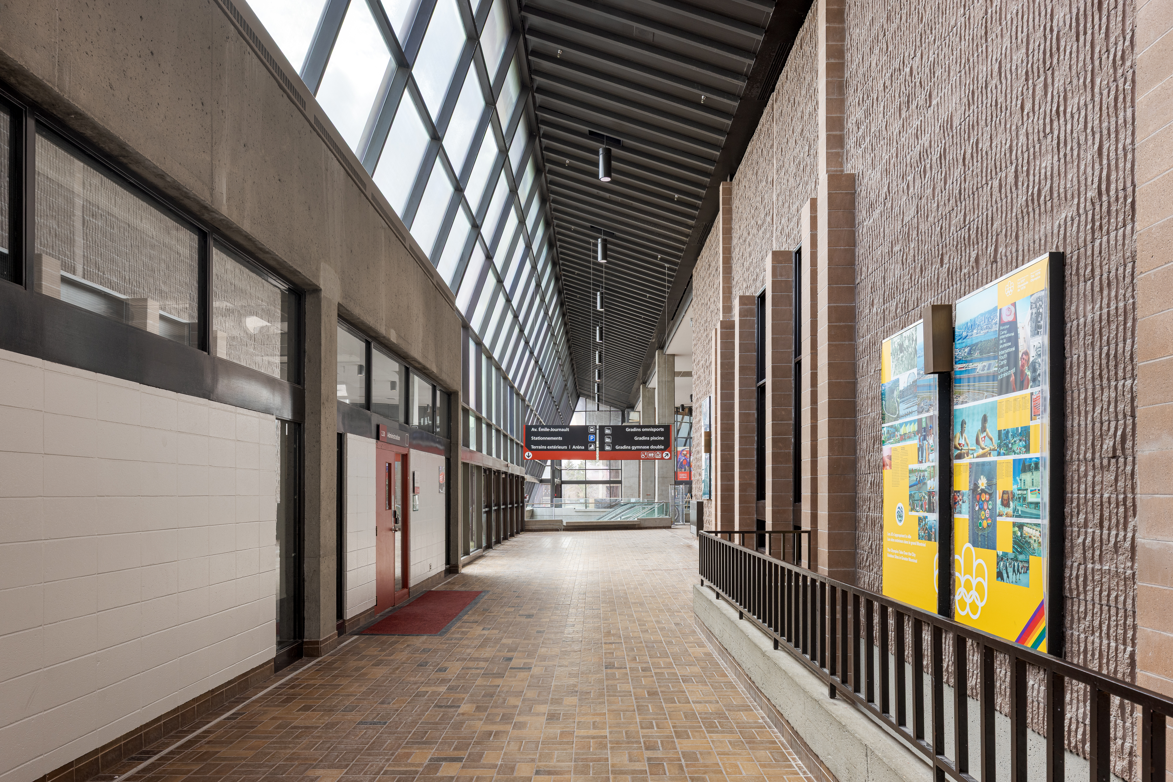 Photograph of architectural heritage, corridor with brick walls, zenithal lighting of the historic building.