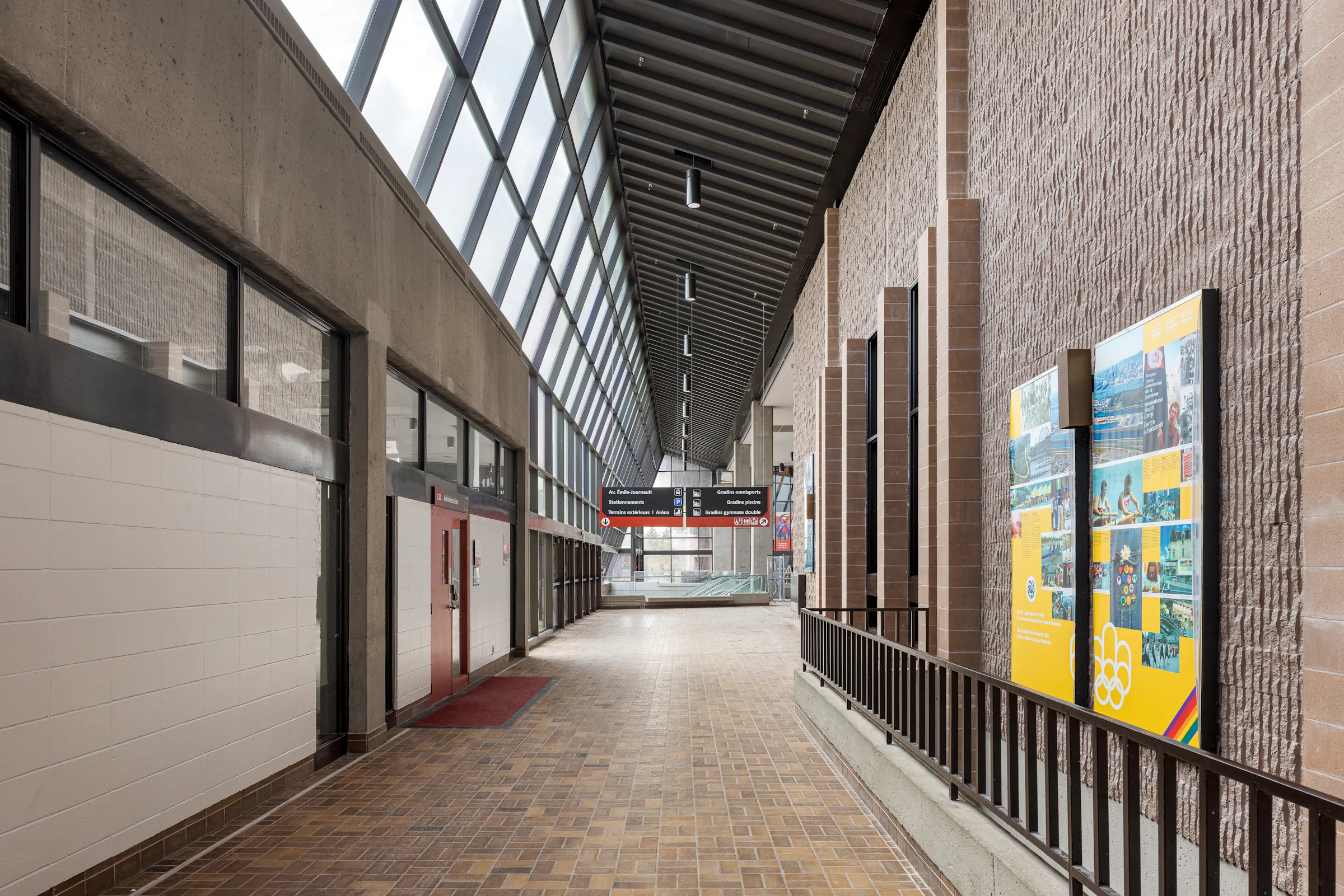 Photograph of architectural heritage, corridor with brick walls, zenithal lighting of the historic building.