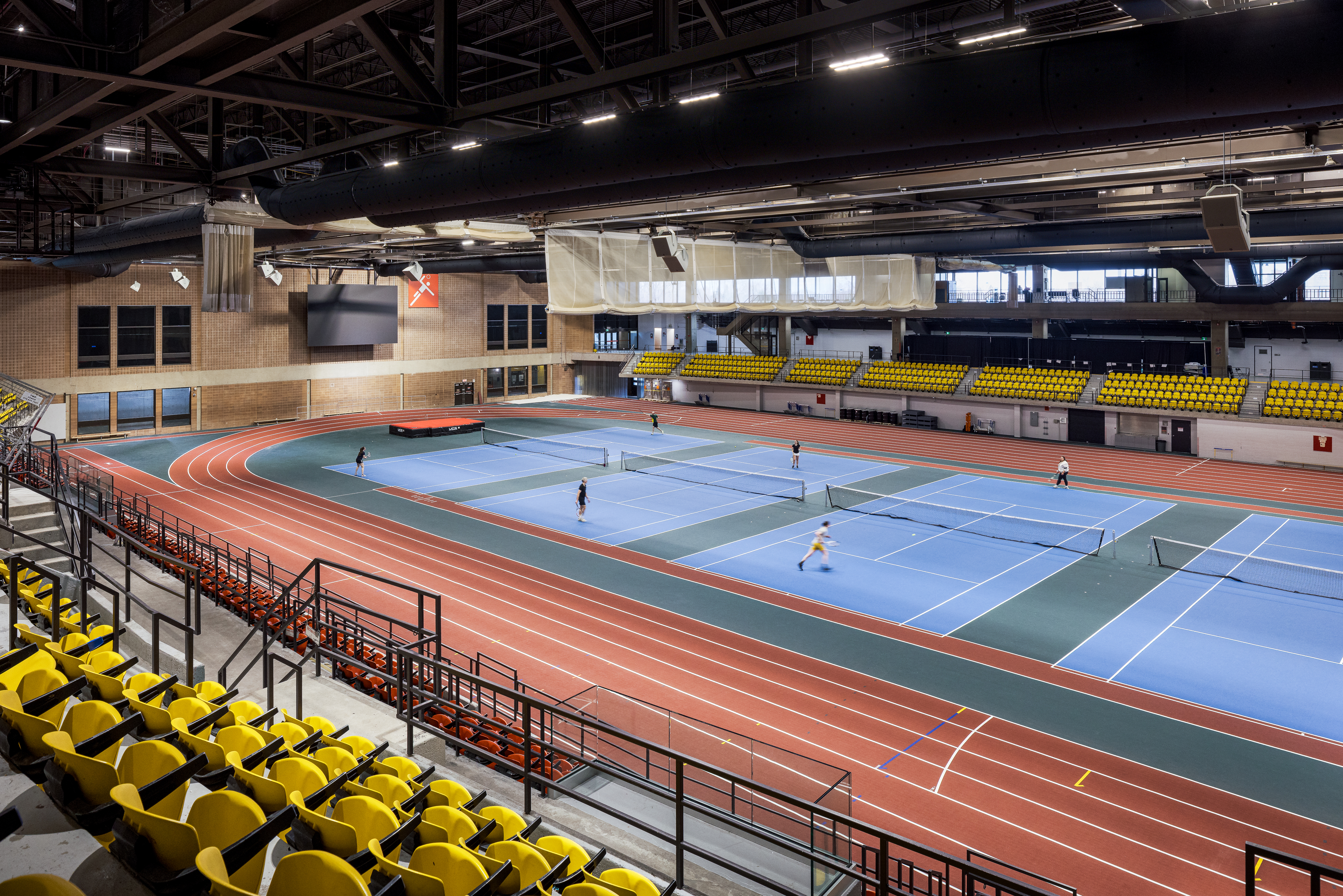 Interior photograph of the tennis courts and track, multi-sports hall of the sports complex.