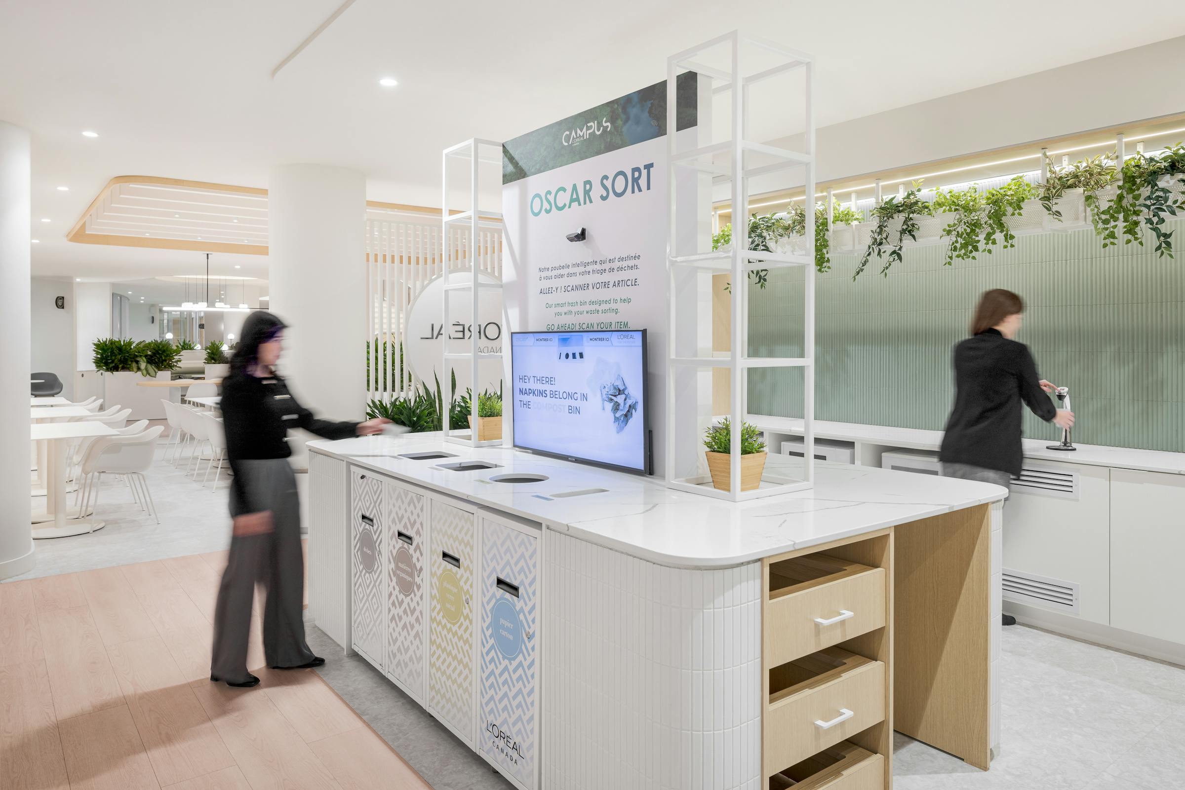 Recycling station in a food court with modern architecture.