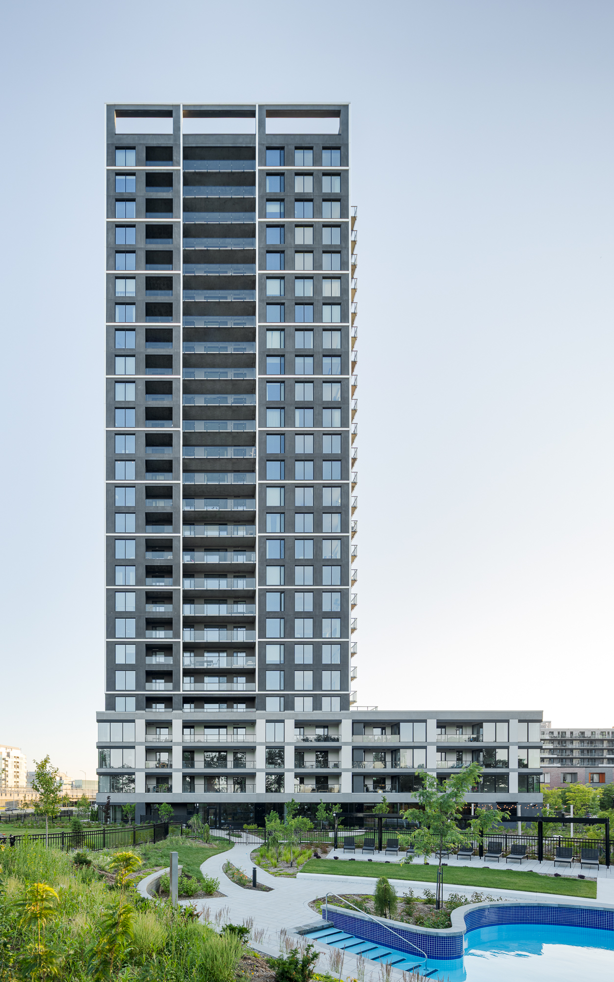Modern architecture of Evolo NEX and landscaping of Pointe Nord on Nuns' Island.