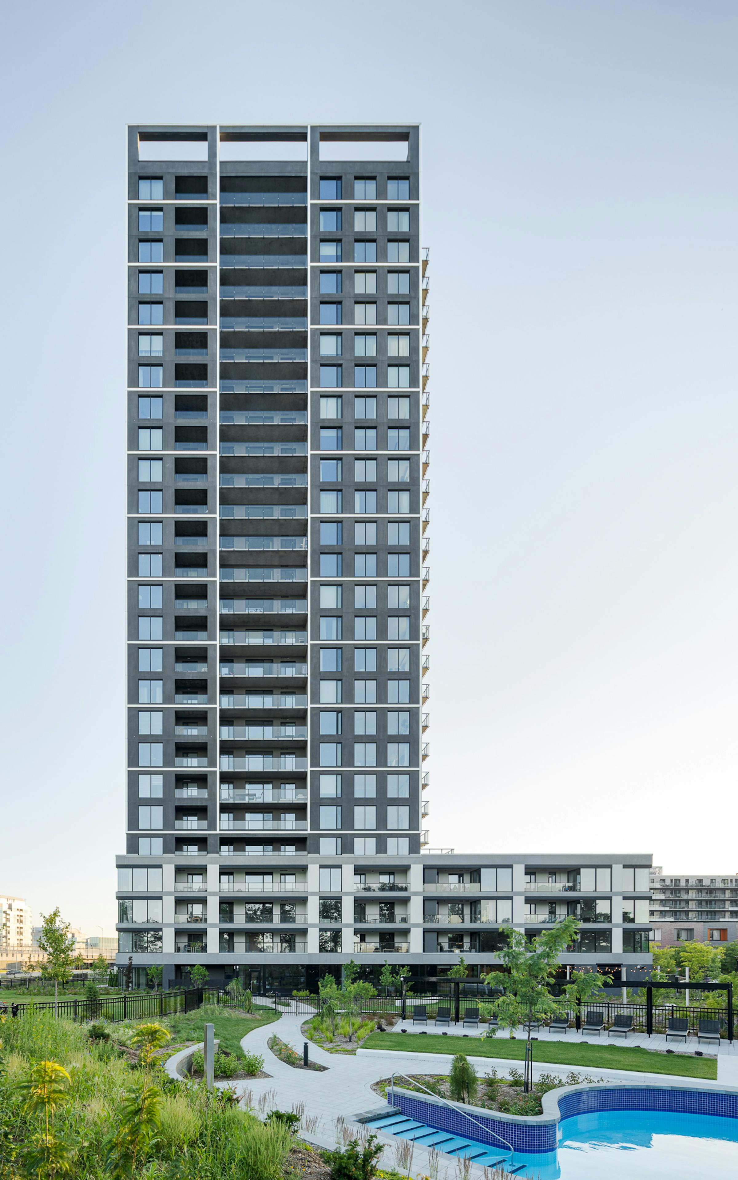 Modern architecture of Evolo NEX and landscaping of Pointe Nord on Nuns' Island.