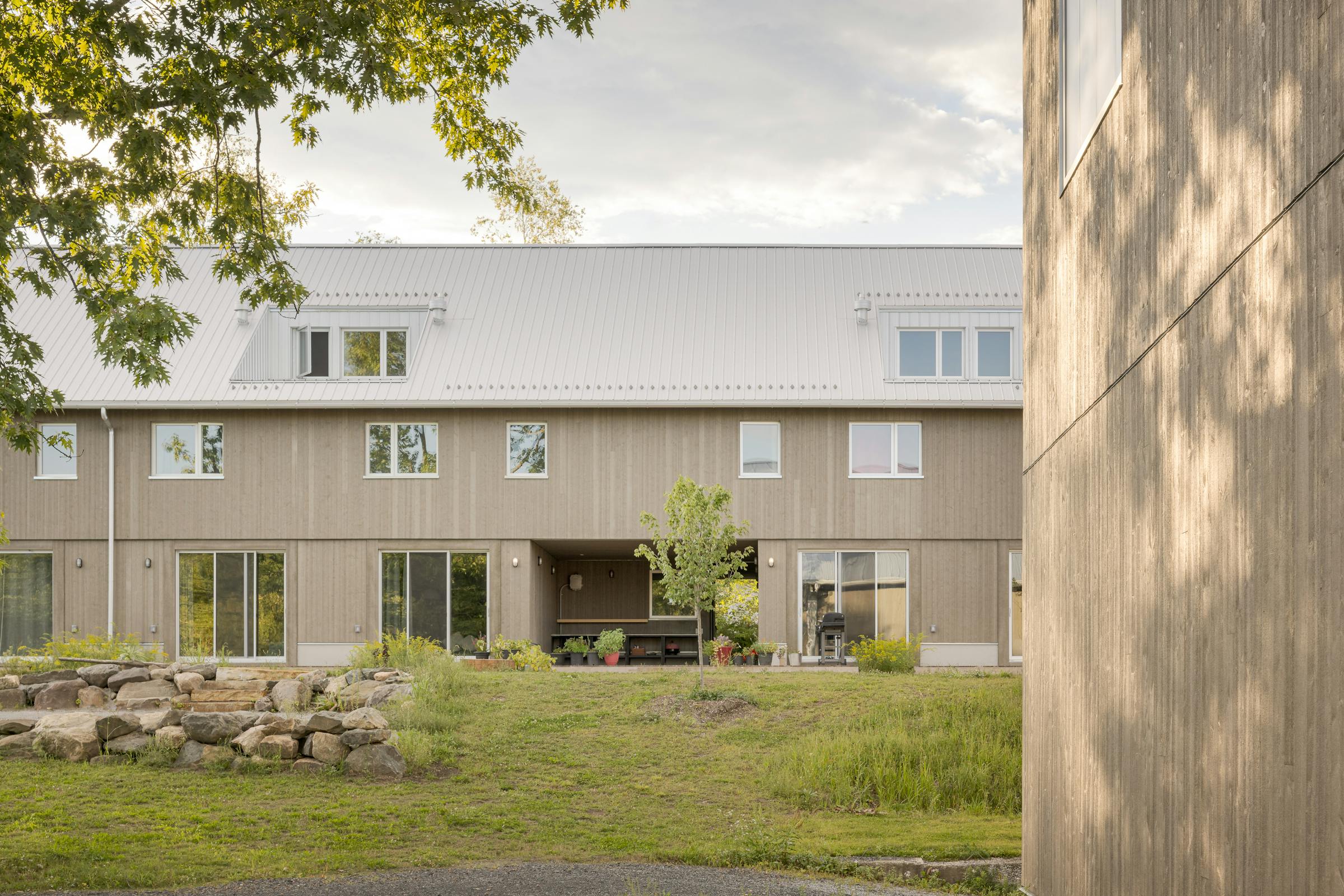 Architectural photograph of the reinterpreted agricultural volumes of the theatre estate.