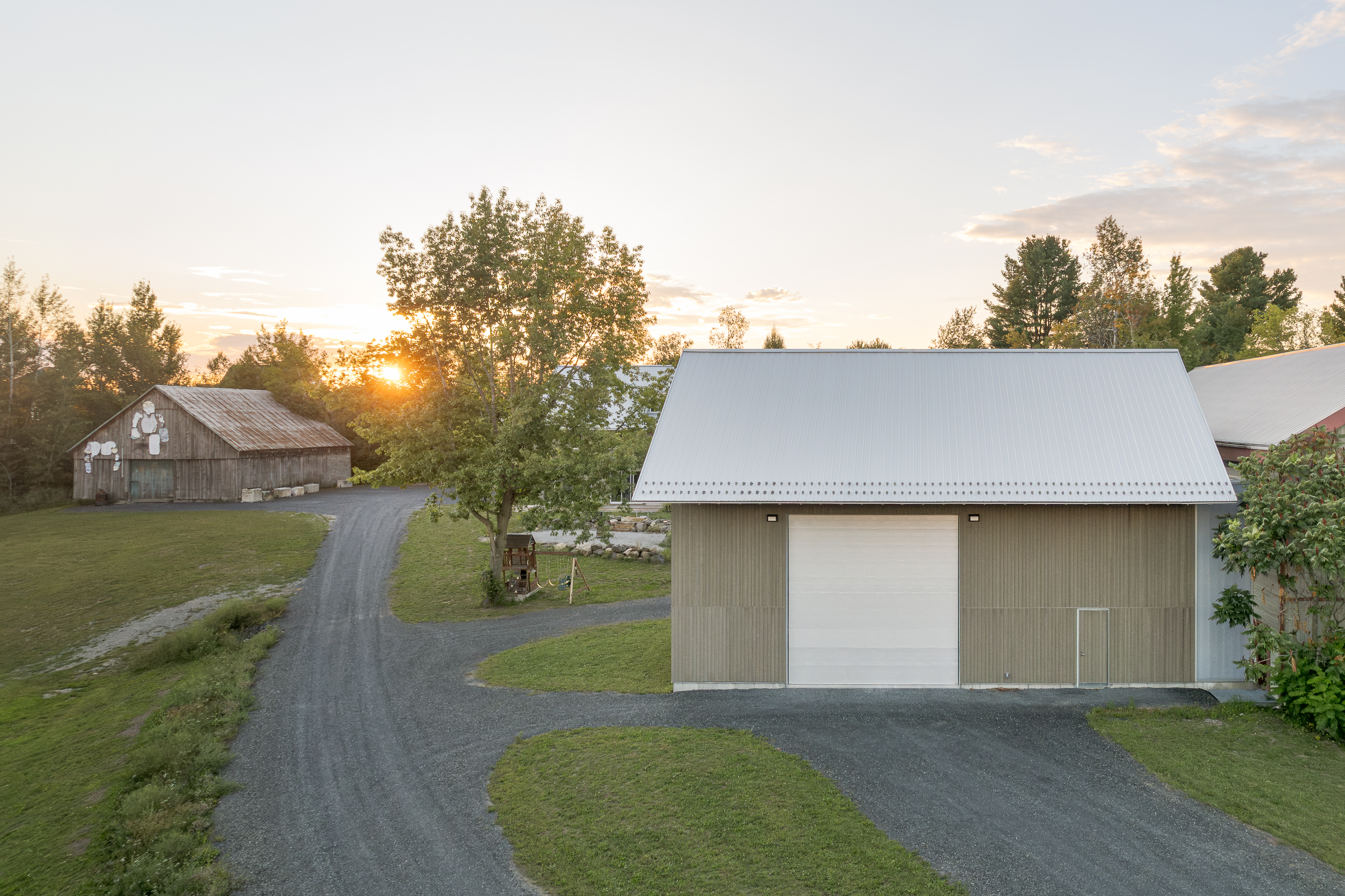 Exterior photograph of new volumes inspired by agricultural architecture.