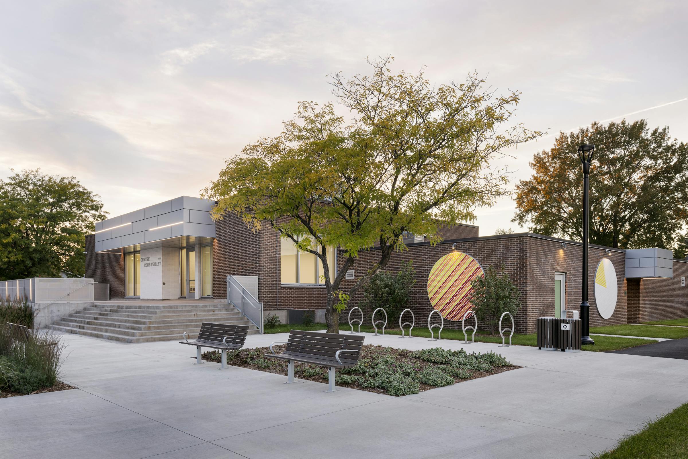 Photograph of the exterior architecture of a park pavilion and landscaping.