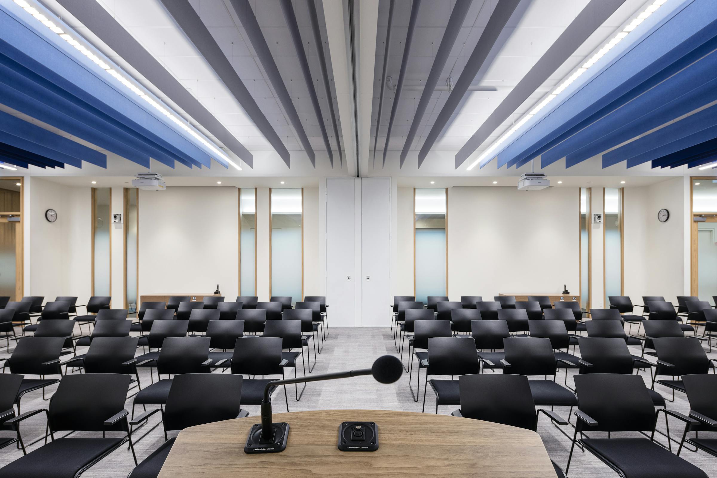 POV photography from the lectern in a conference room with modern architecture and design.