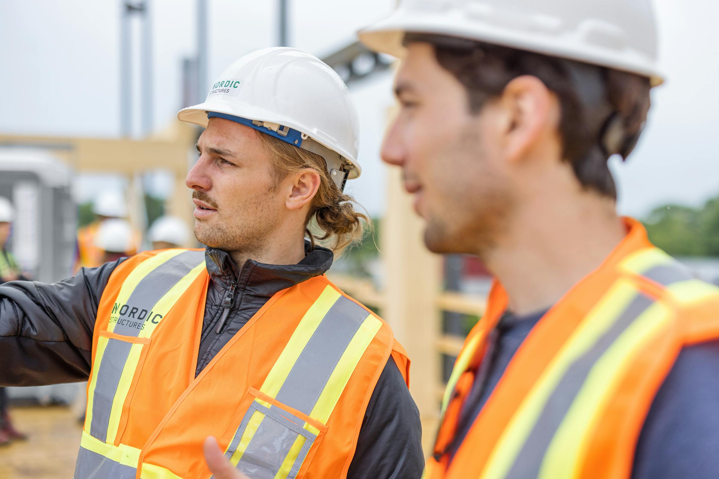 2 structural engineers discussing the current construction project.