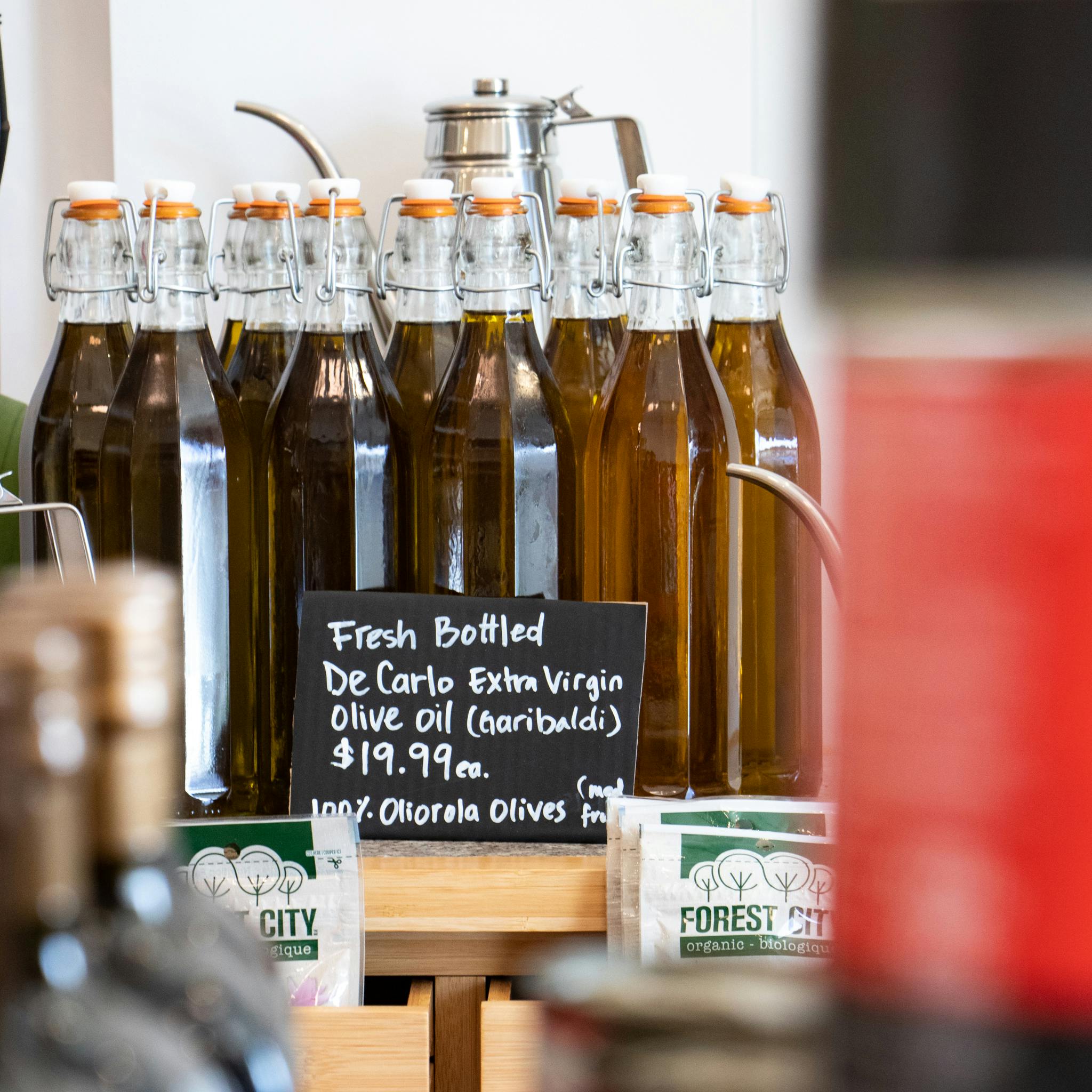 Fresh bottled olive oil from La Spesa Food Market. Image by: @paothebao