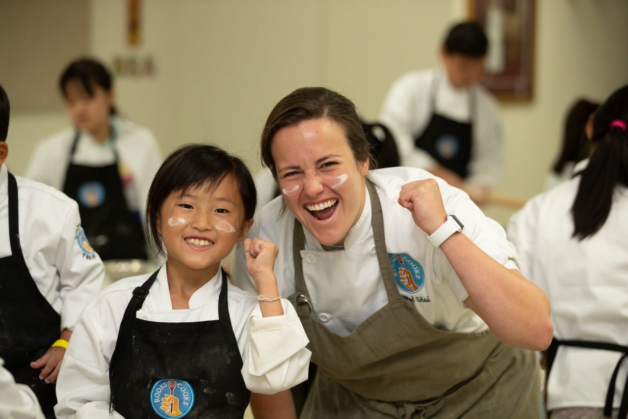 Shai Mendel with a student at Rooks to Cooks