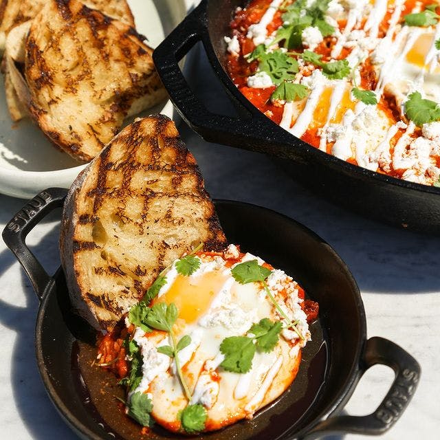 Shakshuka with Lamb Merguez Sausage and Garlic Lemon Yogurt by Chef Erica Karbelnik