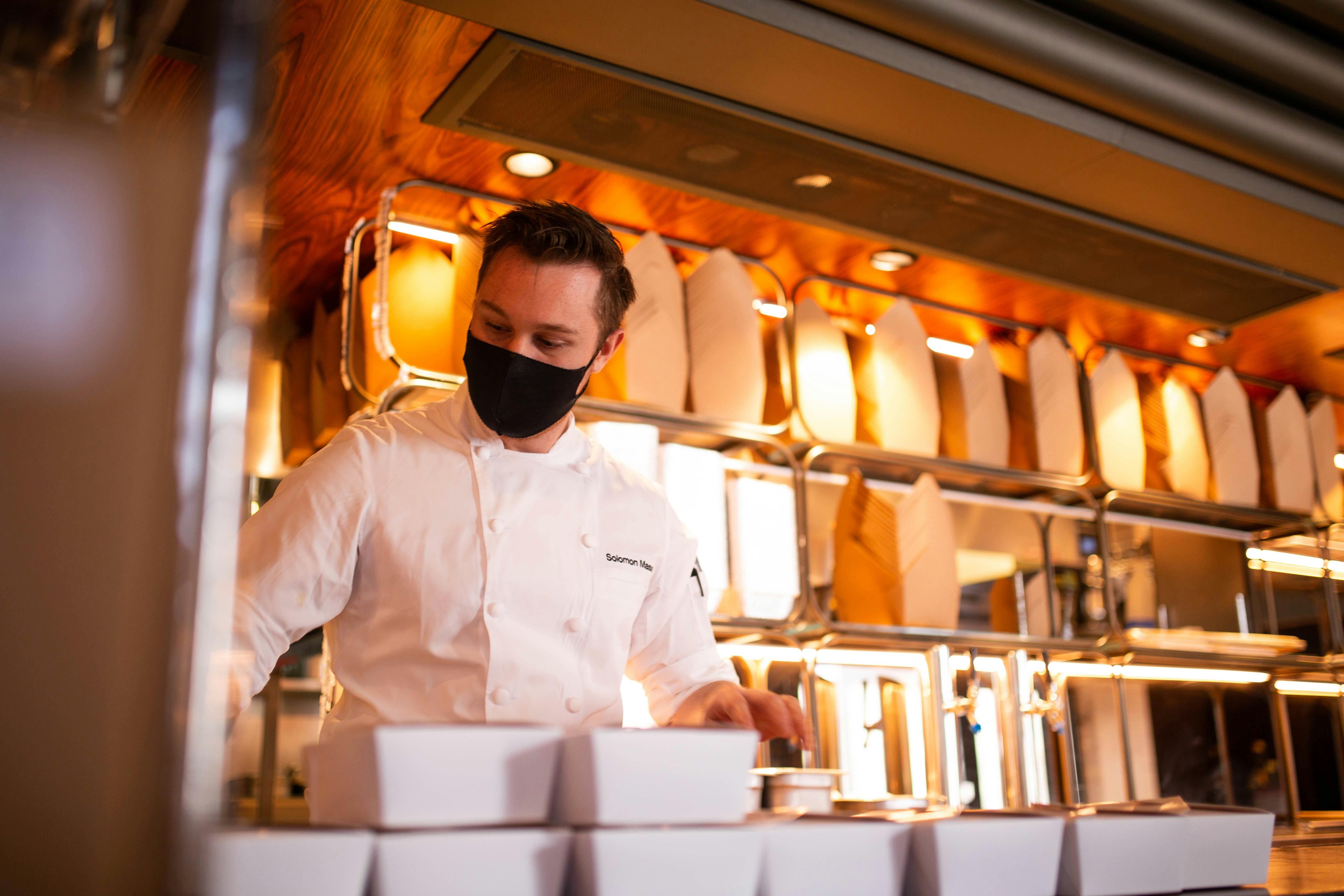 Solomon Mason prepares takeout meals at Aloette in Toronto.