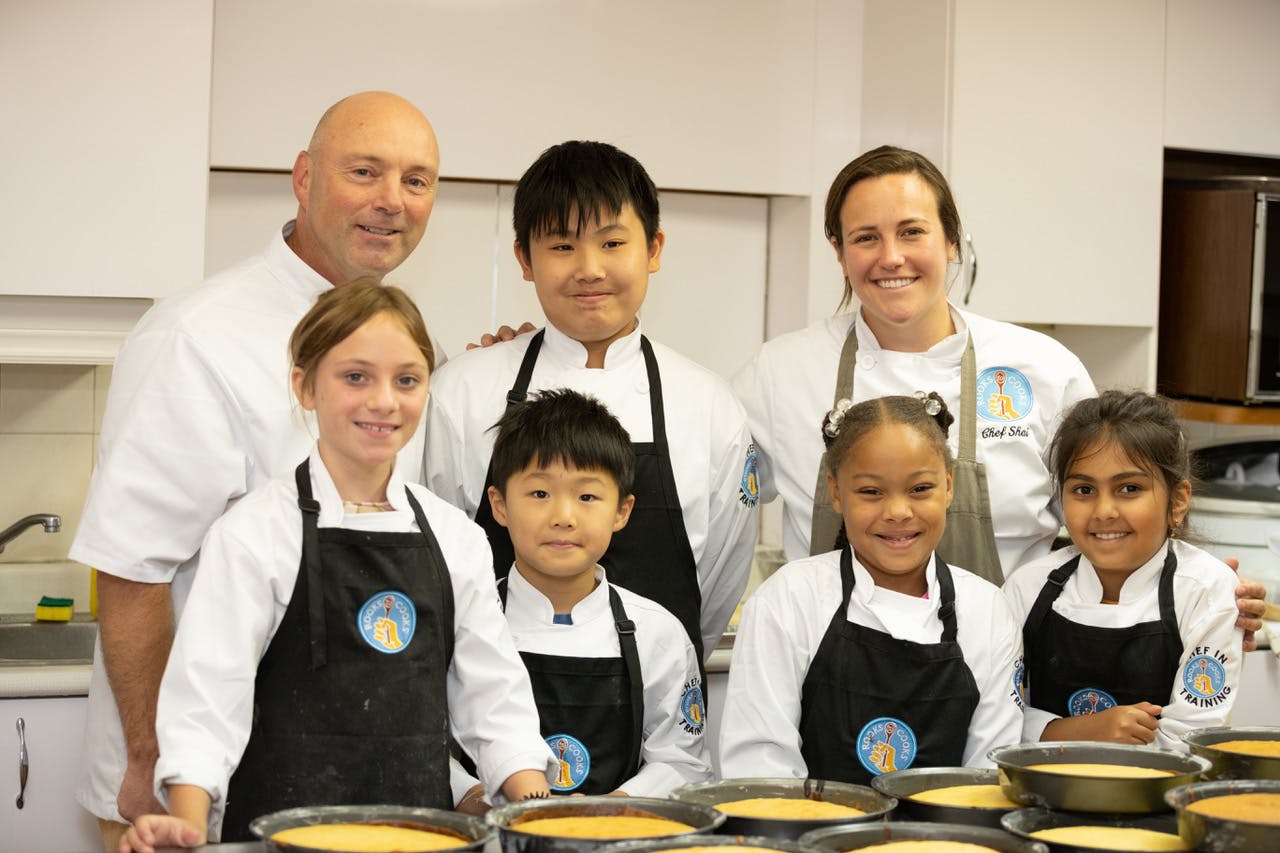 Shai Mendel with a student at Rooks to Cooks