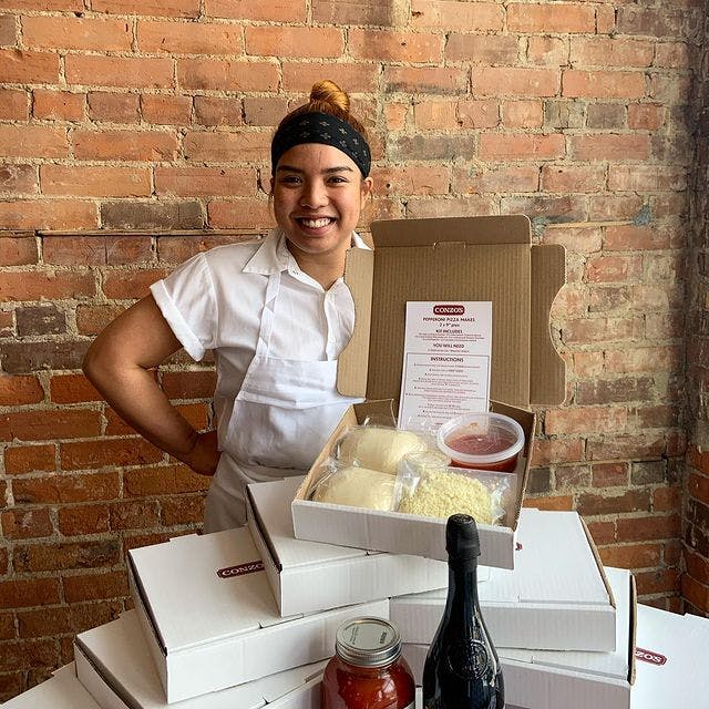 Chef standing with Conzo's Pizza in Bloordale's build your own pizza kit