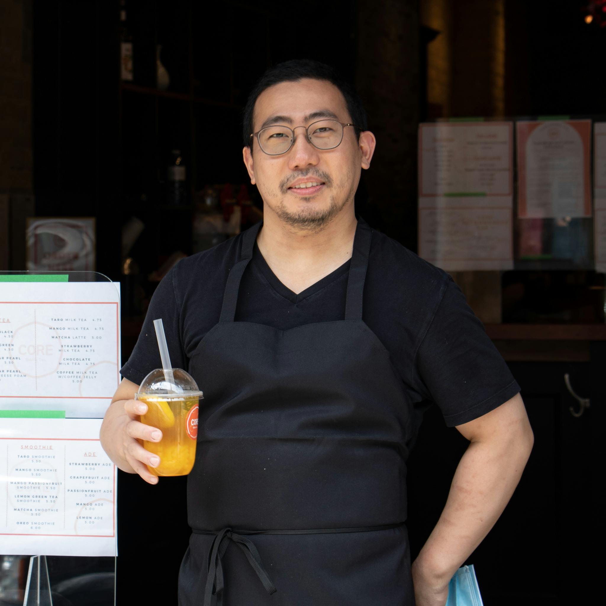 Chef Hyun Jung Kim outside his restaurant holding Core Bubble Tea