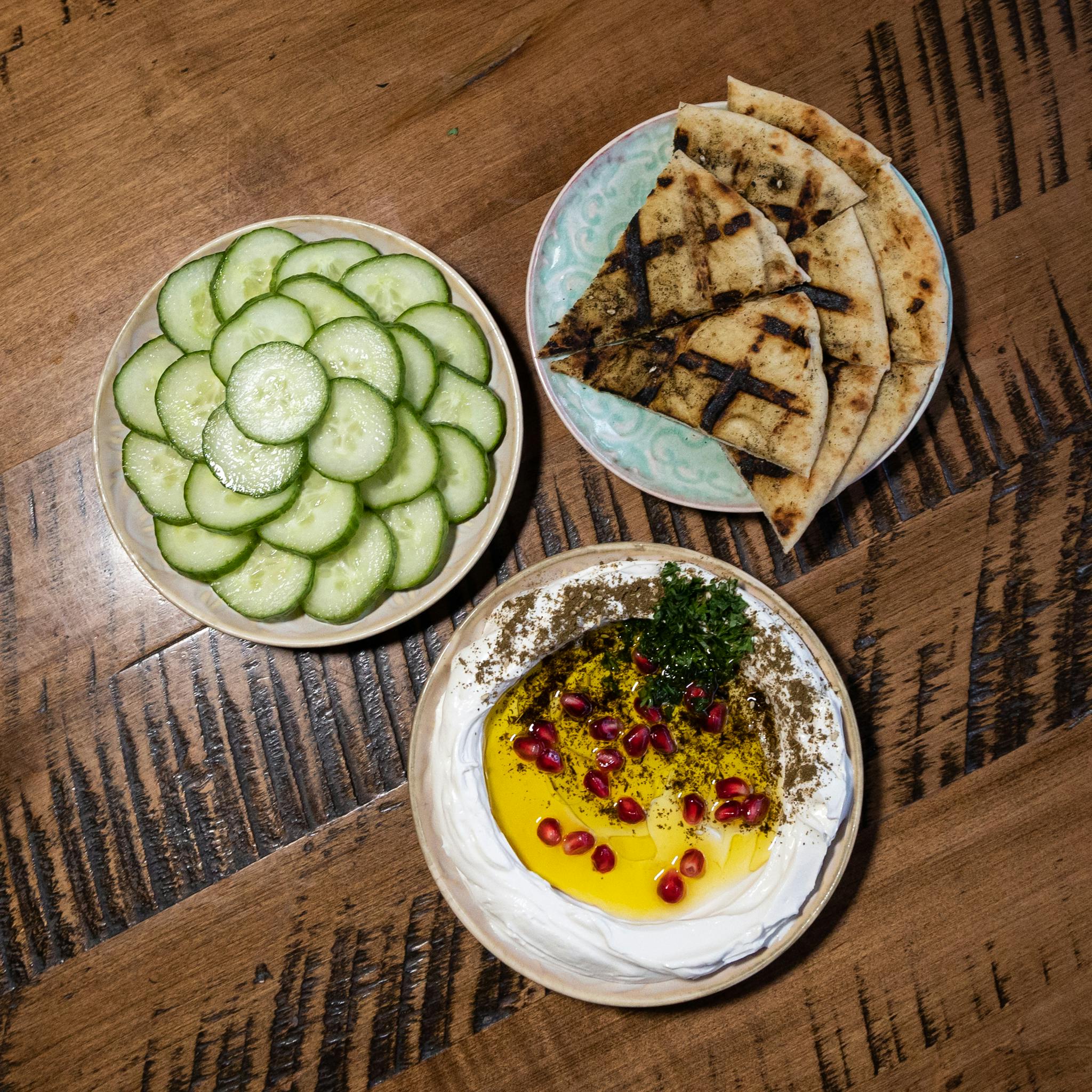 Labneh, spiced pita, and fresh cucumbers