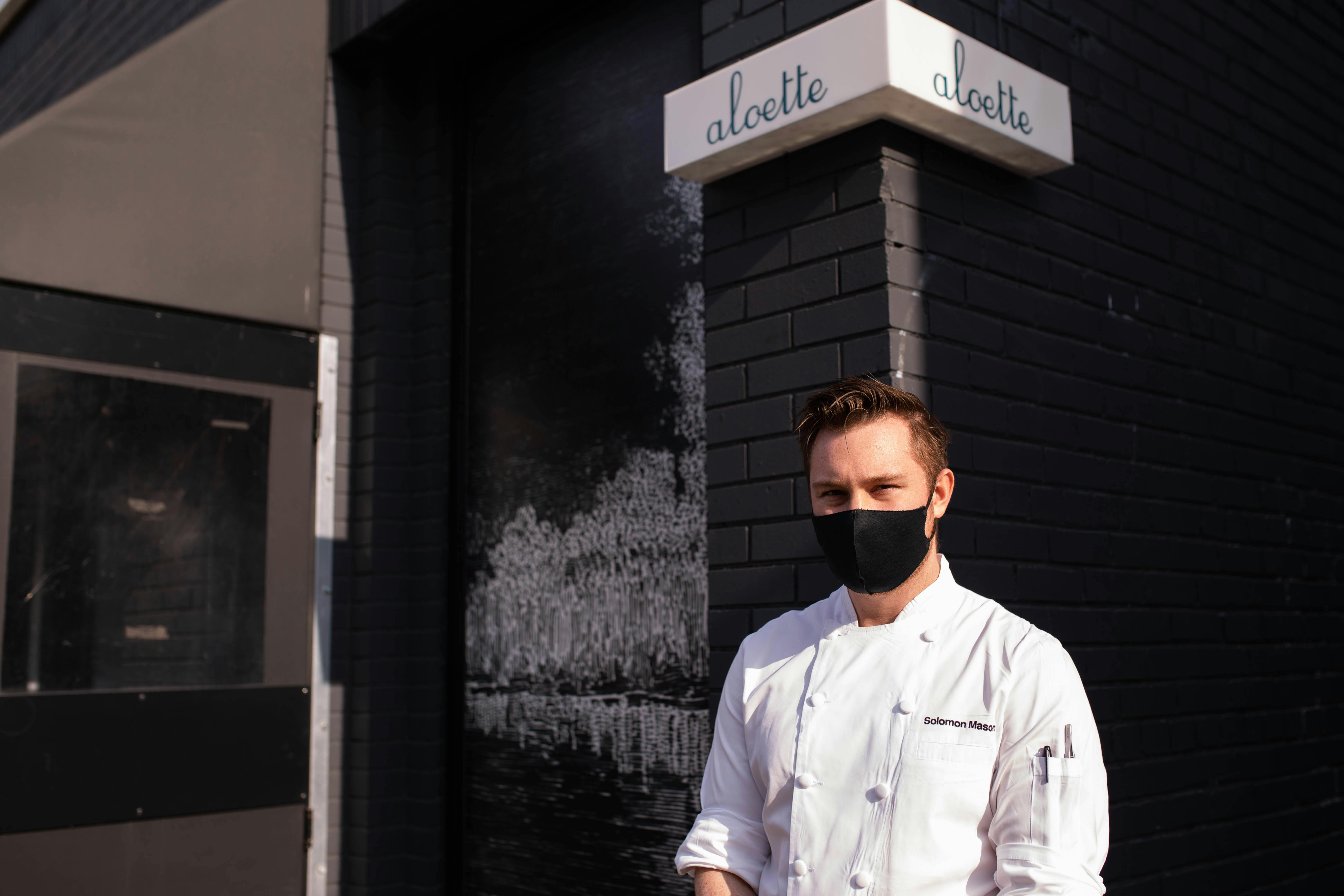 Solomon Mason stands out front of Toronto restaurant Aloette.