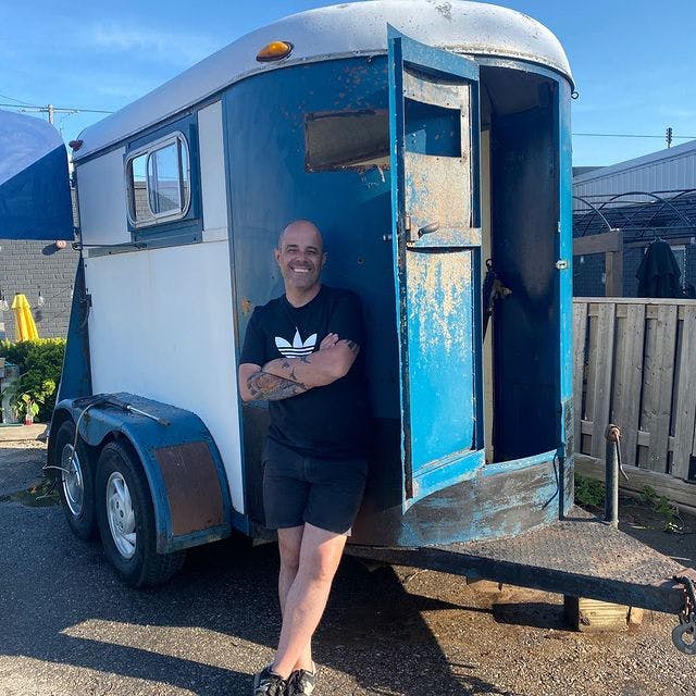 Carlos Oliveira with the pre-renovated horse trailer
