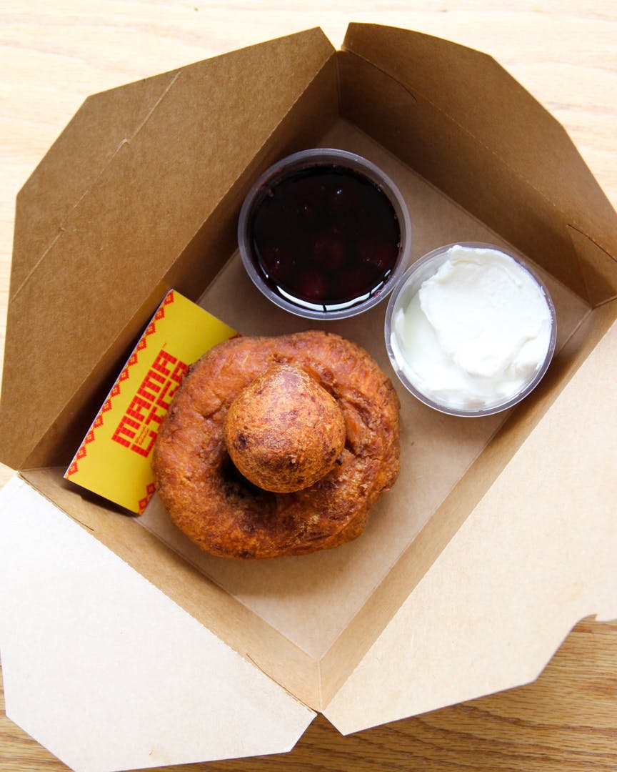 Papanasi (ricotta donuts) with sour cream and cherry compote