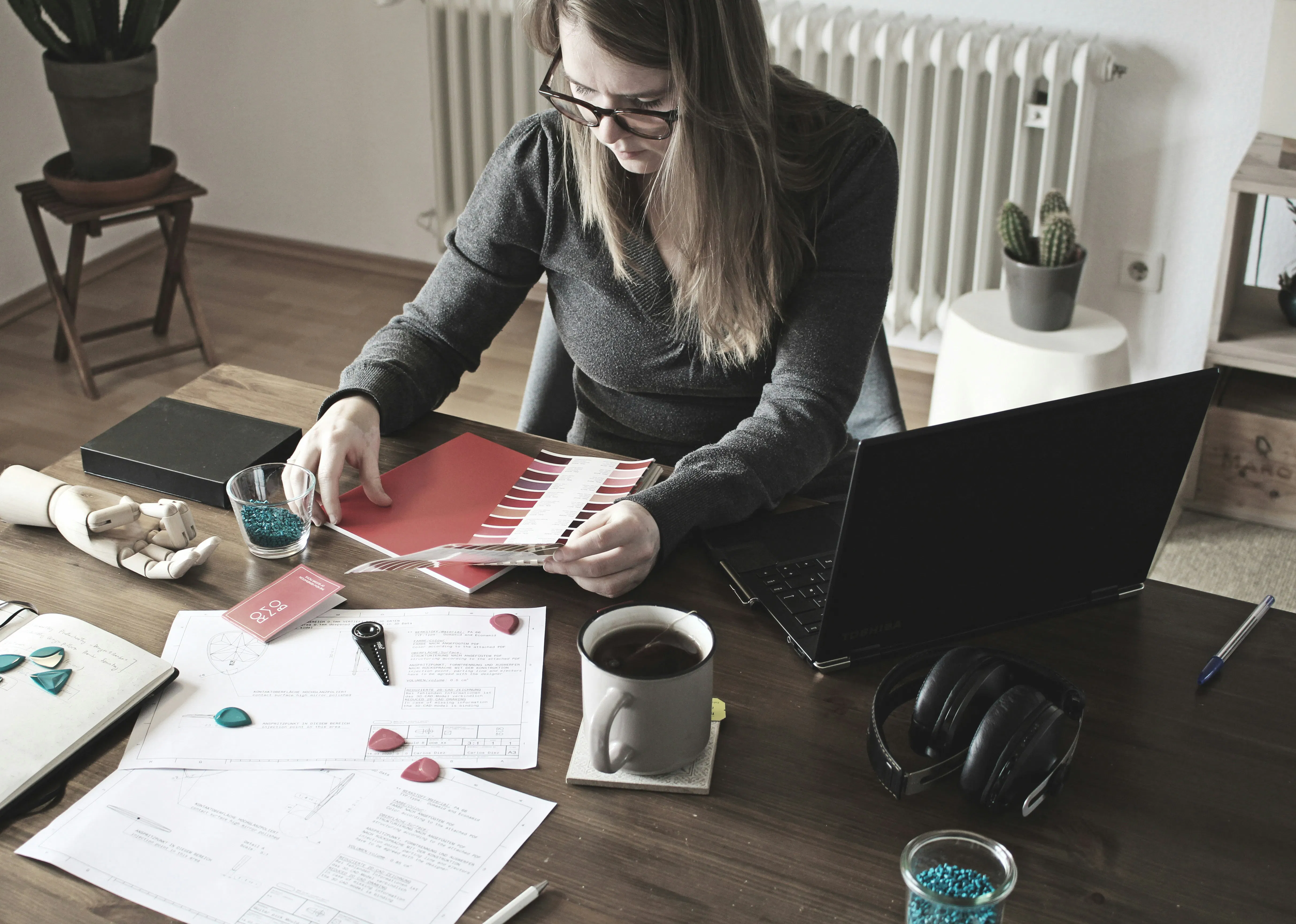 An image showing an accountant comparing manual vs automated MTD document processing time per client at a UK accounting firm