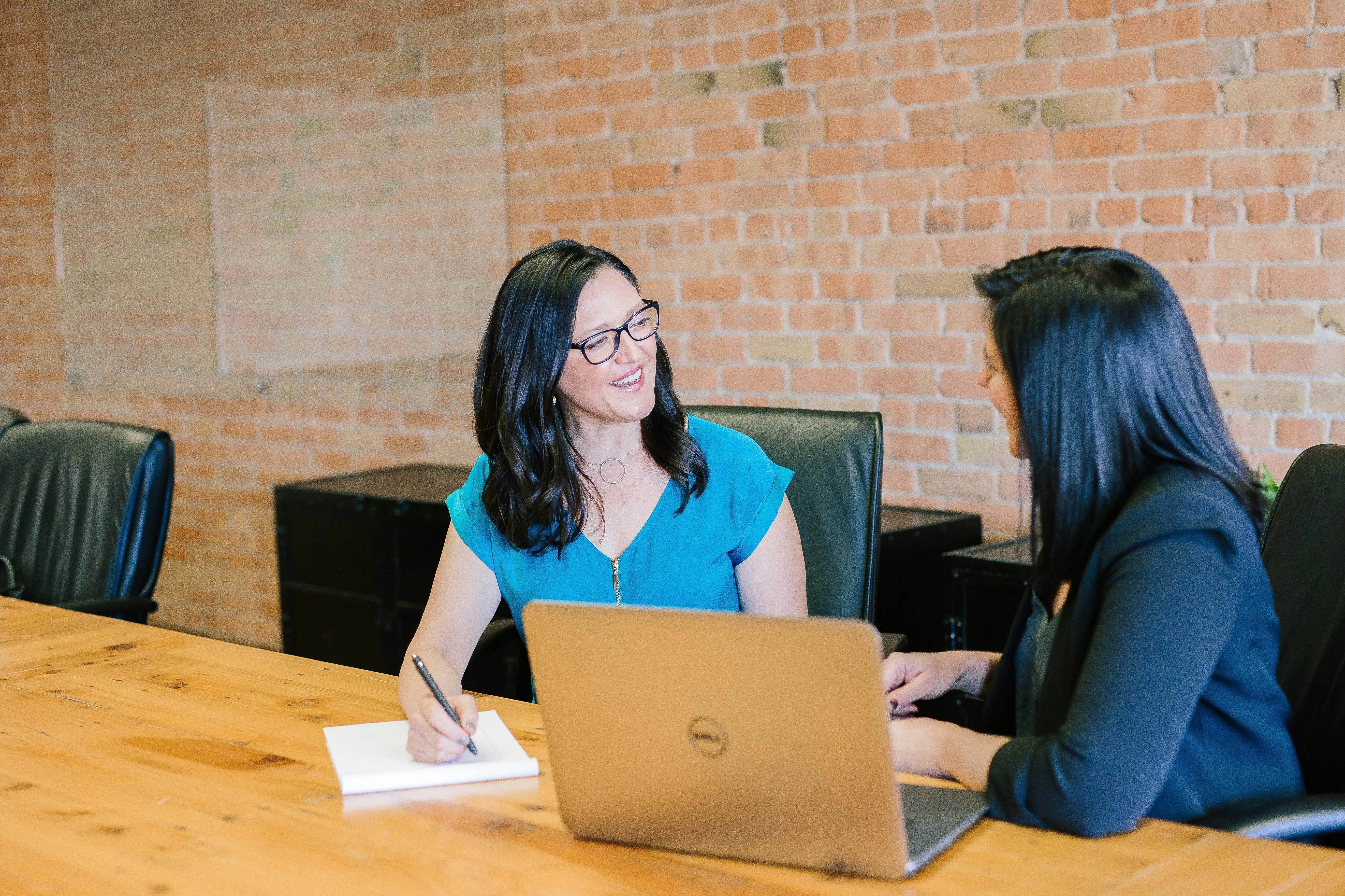 An image showing two accountants filing MTD using Taxiom