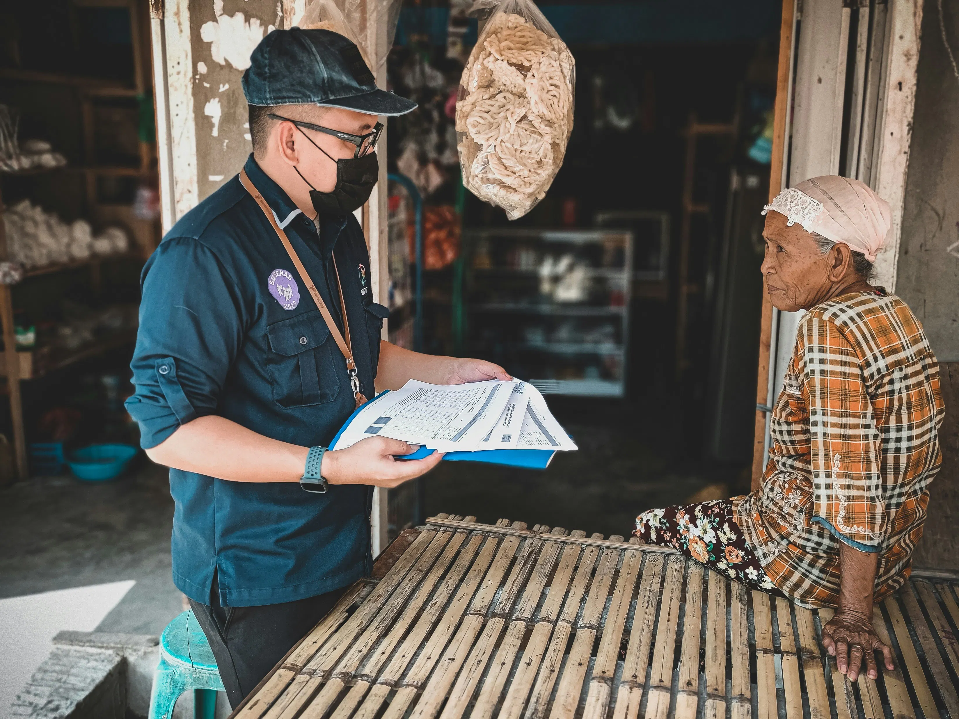 An NGO worker manually collecting data from the field that would be transferred into DHIS2